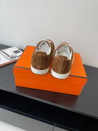 Hermes ladies brown suede sneakers, rear heel panels and white laces visible
