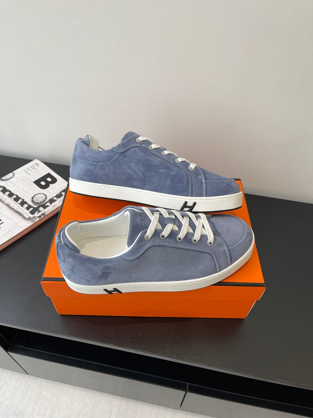 Blue suede lace-up sneakers with white soles and lace-up closure