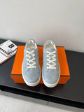Hermes light blue suede lace-up sneakers with white laces and rubber sole
