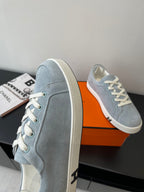 Hermes light blue suede sneakers, side profile with white lace-up and sole
