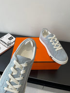 Hermes light blue suede sneakers with white laces and cushioned collar