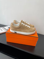 Hermes ladies low-top sneakers, tan suede, white lace-up front