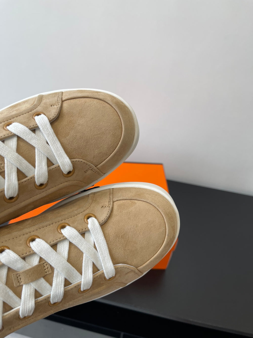 Hermes ladies tan suede sneakers, close-up of toe and white laces