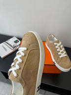Hermes ladies tan suede sneakers with white laces, heel and side view