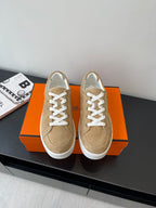 Hermes ladies sneakers in tan suede with white laces and rubber sole