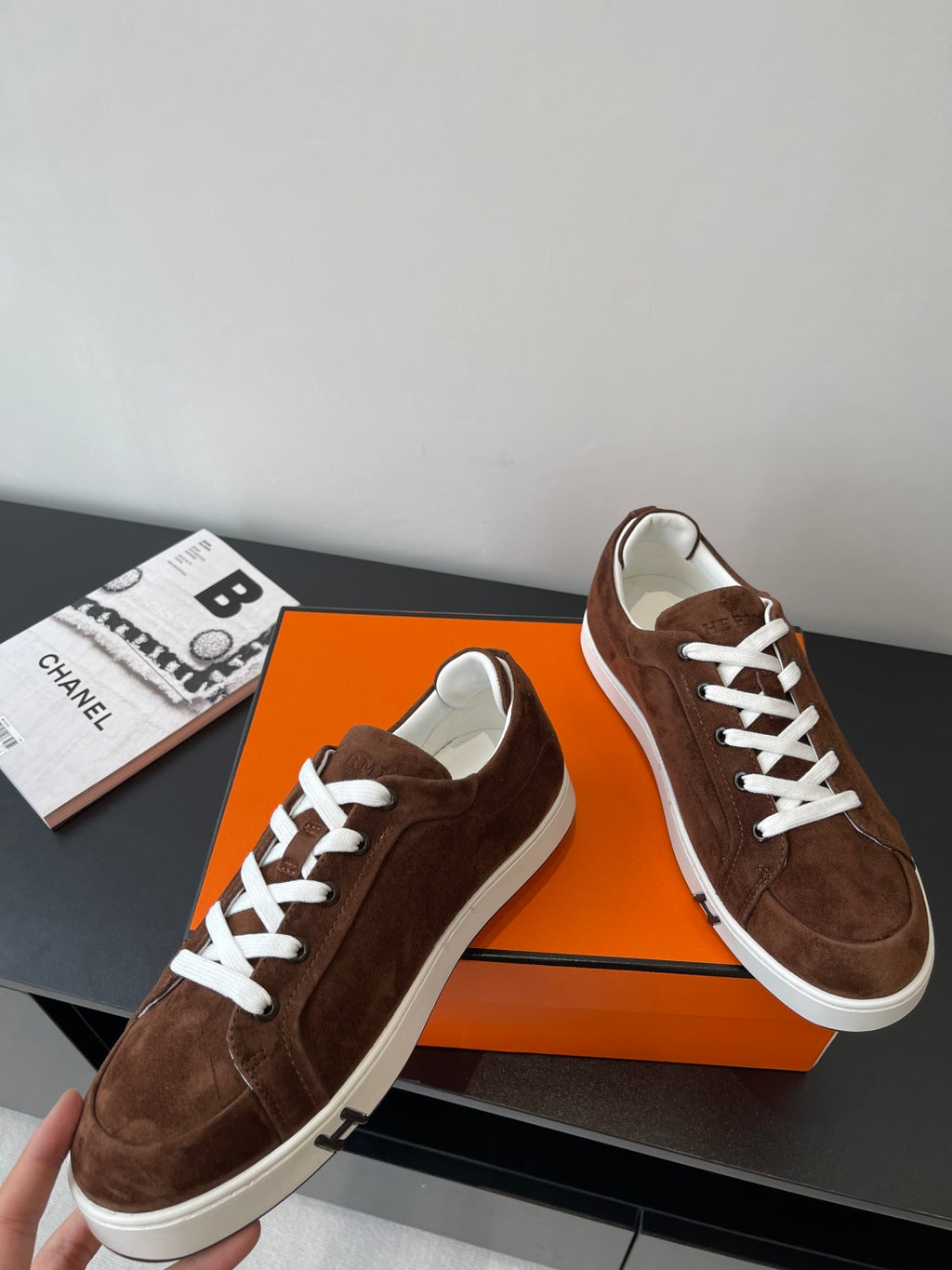 Brown suede low-top sneakers with white laces and white midsole
