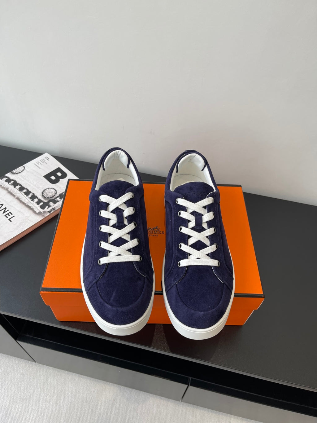 Hermes women's low-top sneakers in navy suede with white lace-up and white rubber sole