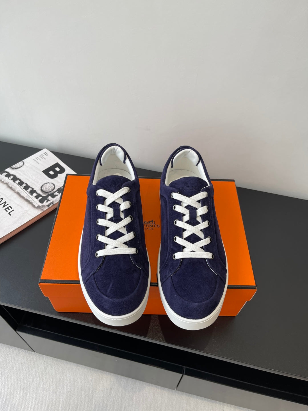 Hermes women's low-top sneakers in navy suede with white lace-up and white rubber sole
