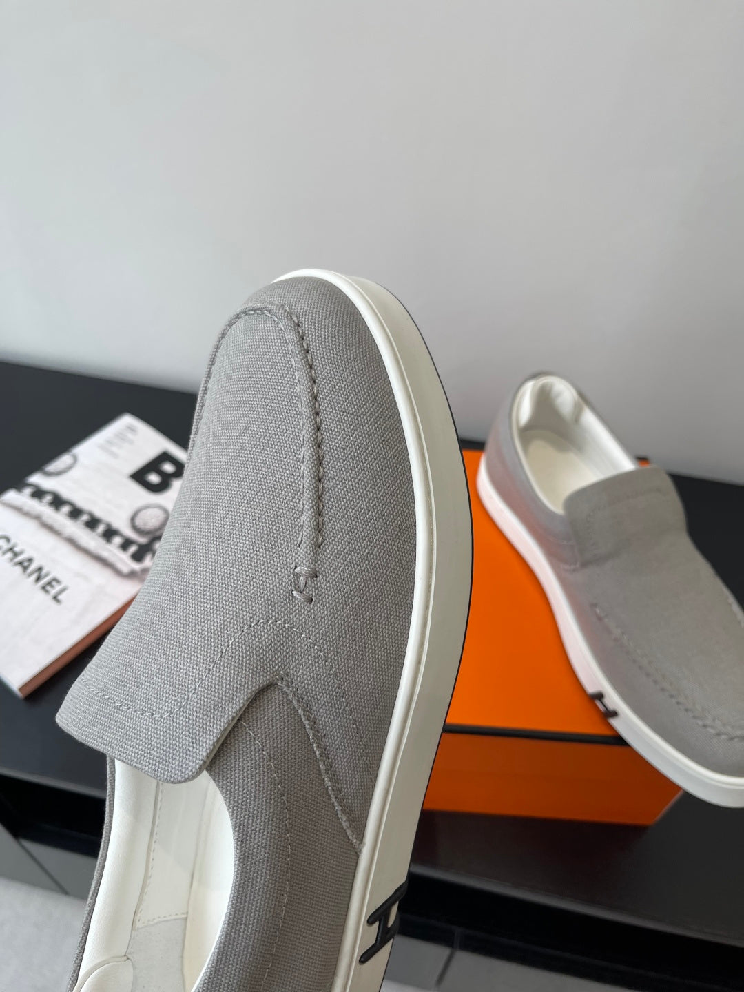 Hermes low-top slip-on sneakers, light gray upper with white rubber sole and stitching