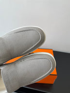 Hermes slip-on sneakers, close-up of light gray canvas toe and side stitching