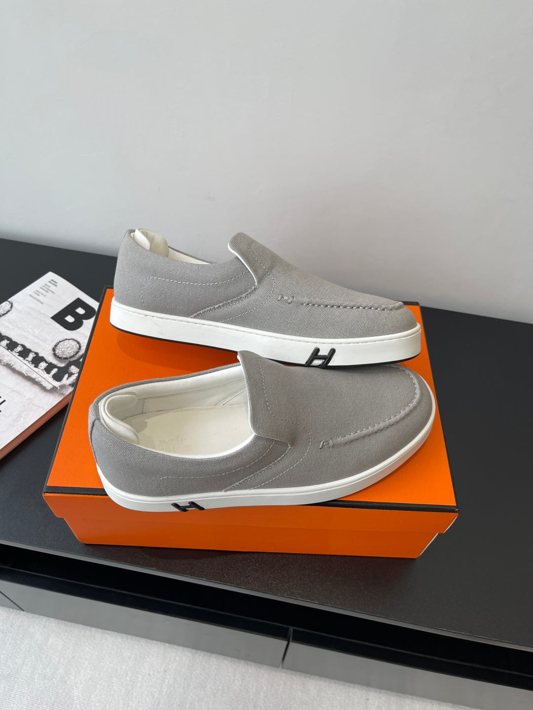 Hermes pair of light gray slip-on sneakers, small emblem detail and white sole