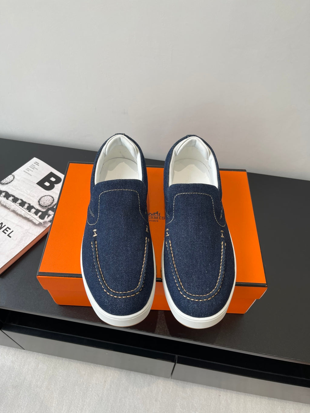 Hermes women's navy denim slip-on sneakers with white sole and side stitching