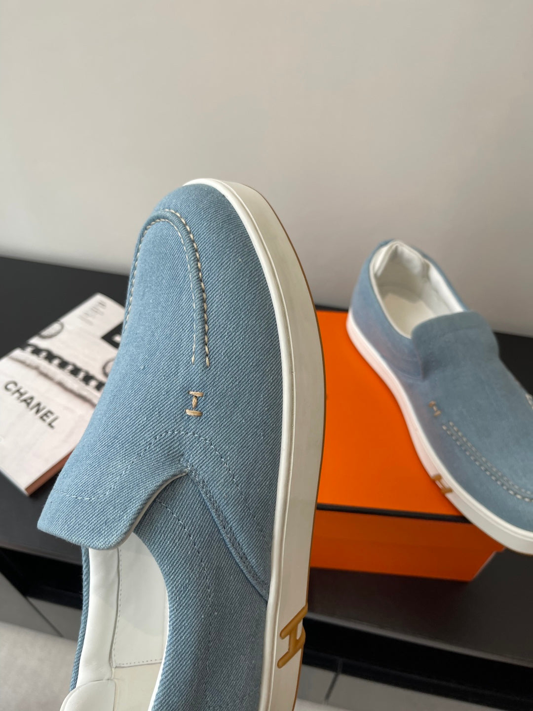Hermes ladies blue denim slip-on loafers with gold emblem and white sole