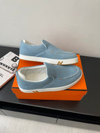 Hermes ladies light-blue slip-on loafers with white sole and low vamp stitching