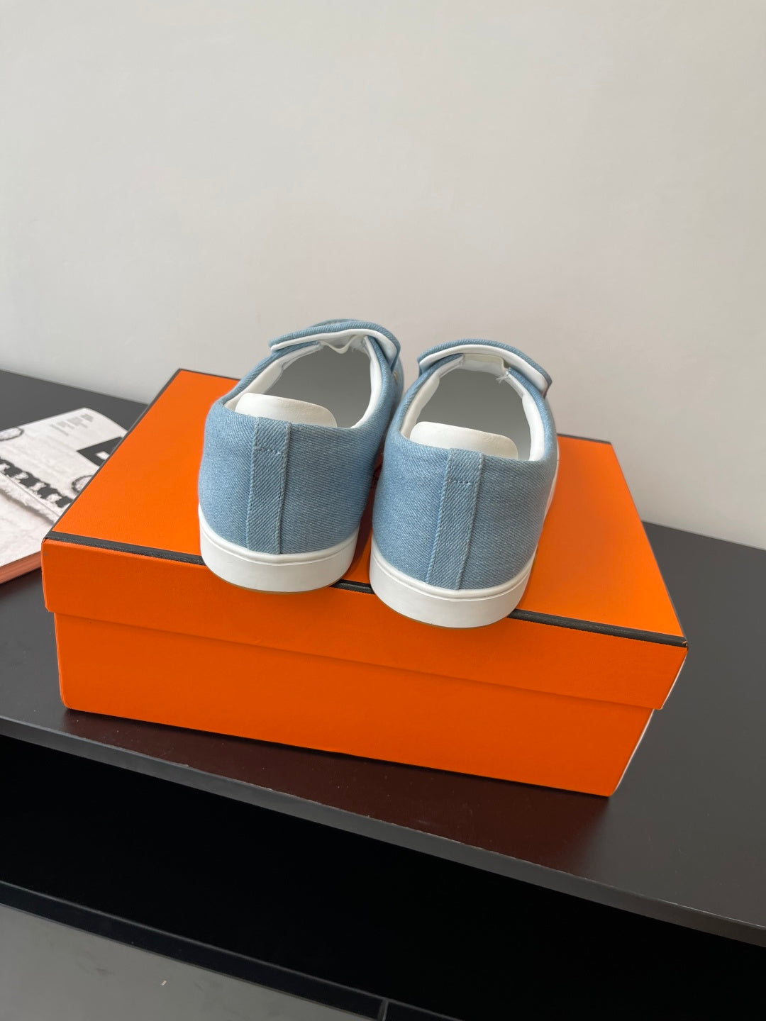 Hermes ladies blue denim slip-on loafers, heel and back collar view, white sole