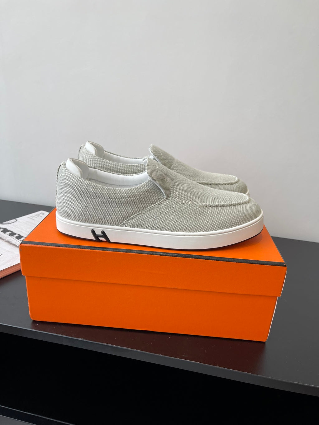 Hermes ladies light gray canvas slip-on sneakers, white rubber sole, side logo detail