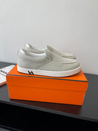 Hermes ladies light gray canvas slip-on sneakers, white rubber sole, side logo detail