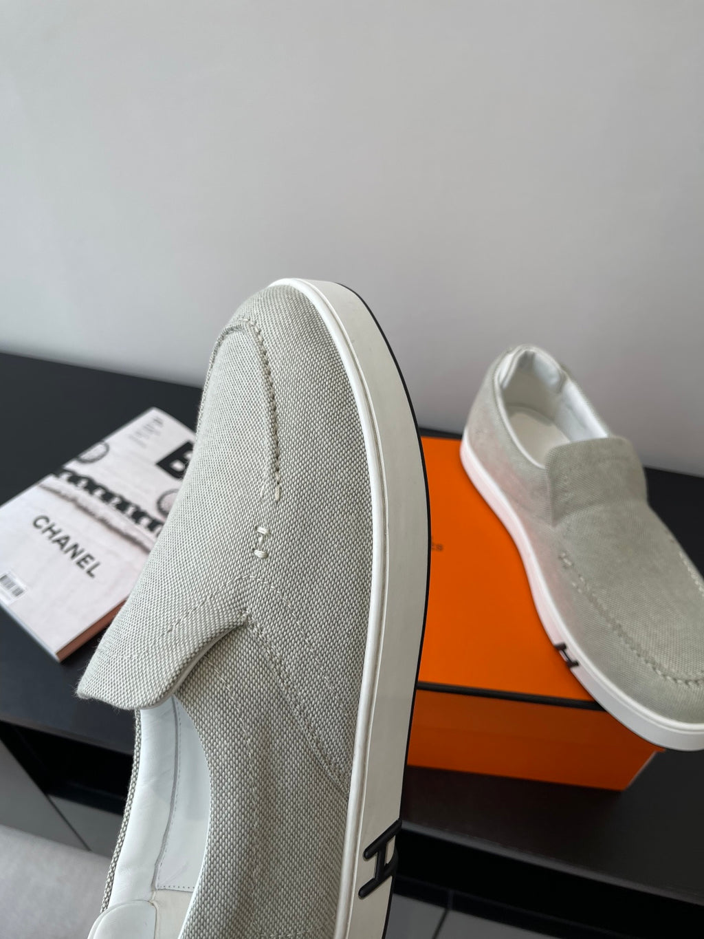 Hermes ladies light gray canvas slip-on sneakers, heel seam detail, white rubber sole
