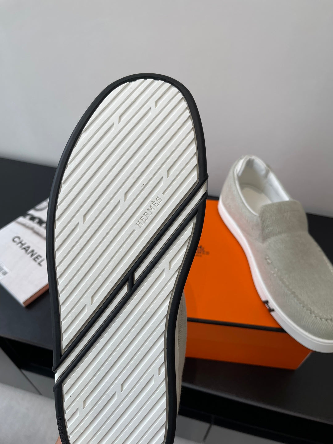 Hermes ladies slip-on sneakers outsole, textured white tread with black edge trim