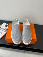 Hermes women’s gray suede slip-on sneakers with white rubber sole, round toe