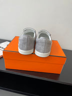 Hermes women’s gray suede slip-on sneakers, pair view with rear styling