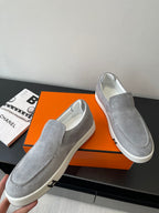 Hermes women’s gray suede slip-on sneakers, side view with visible stitched seams