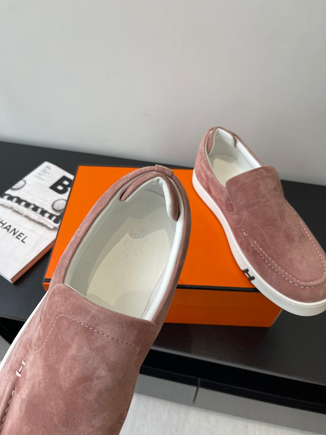 Ladies mauve suede loafers with cushioned interior lining and white rubber sole edge