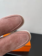 Close-up of mauve suede loafer vamp with contrast stitching and rounded toe
