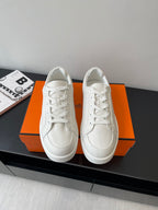 Hermes women’s white low-top sneakers, lace-up leather with H side logo