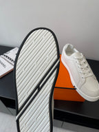Hermes women’s white sneaker outsole, grippy tread with dark edge trim