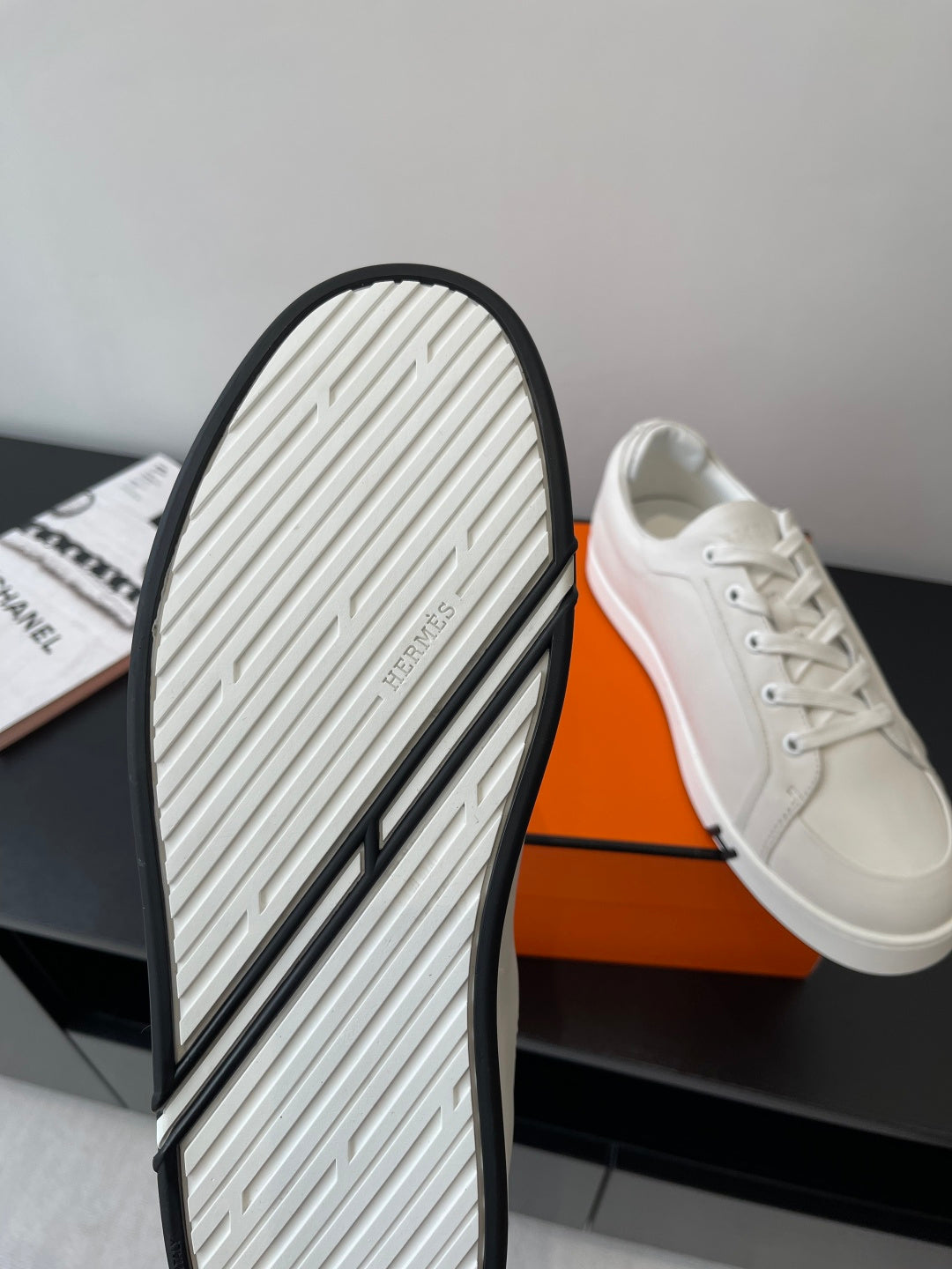 Hermes women’s white sneaker outsole, grippy tread with dark edge trim