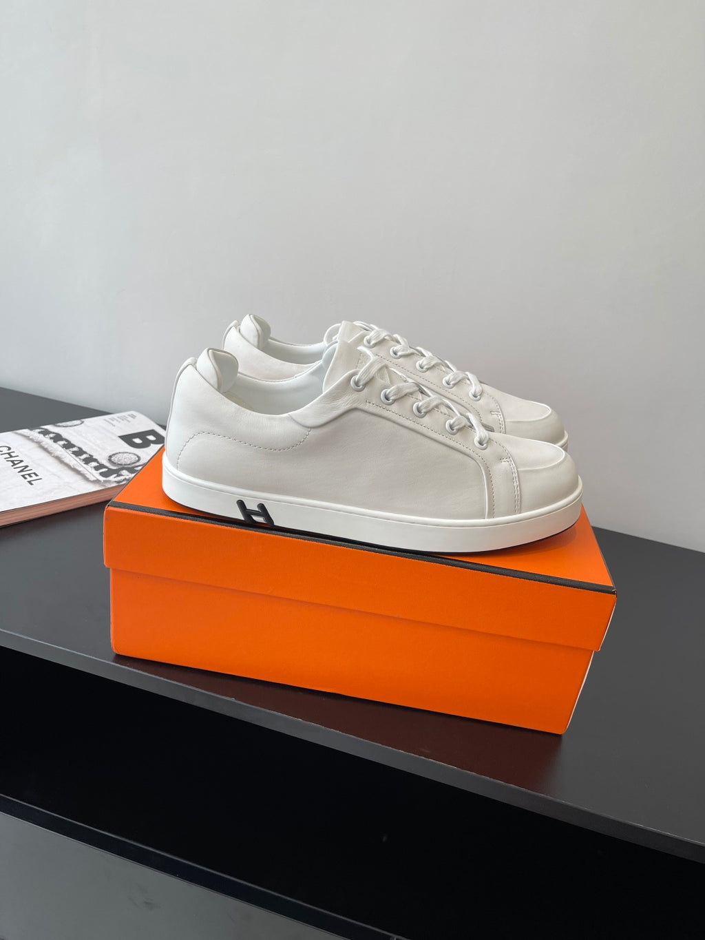 Hermes women’s white lace-up sneakers with H detail on side, low-top leather