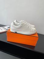 Hermes women’s white lace-up sneakers with H detail on side, low-top leather