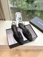 Black Chanel women's slingback shoes with textured uppers and slim pointed toe