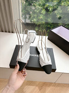 Chanel ladies slingback shoes, white textured upper with black heel and pointed toe, held