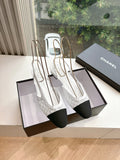 Chanel ladies slingback shoes, white textured upper with black heel, on display boxes