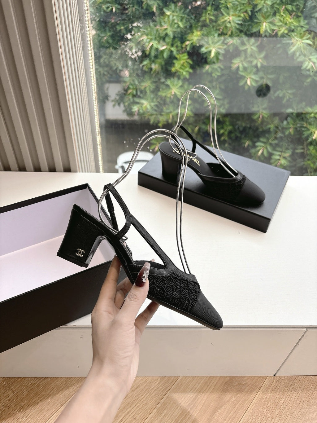 Black Chanel slingback heel shoes with logo strap detail and textured uppers