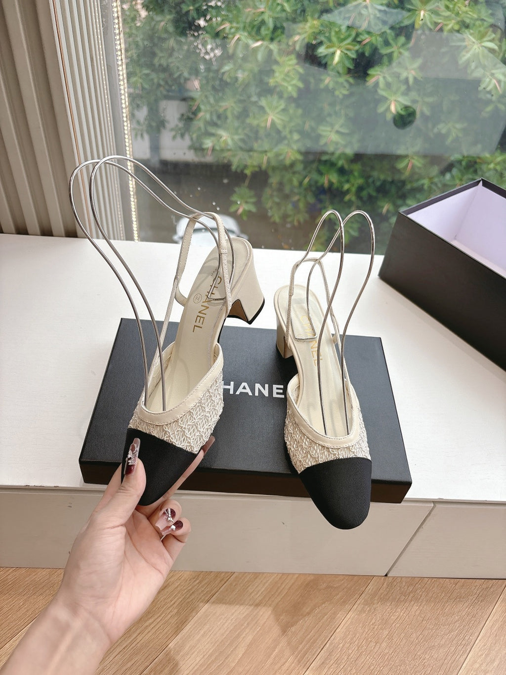 Two-tone women’s slingback heels with Chanel logo strap, textured beige and black