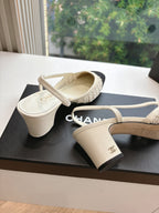 Two-tone women’s slingback heels with Chanel logo on strap and black toe caps