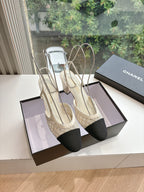 Two-tone women’s slingback heels with black toe caps and textured beige sides