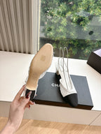 Two-tone slingback heel showing underside with cork-toned sole and white upper