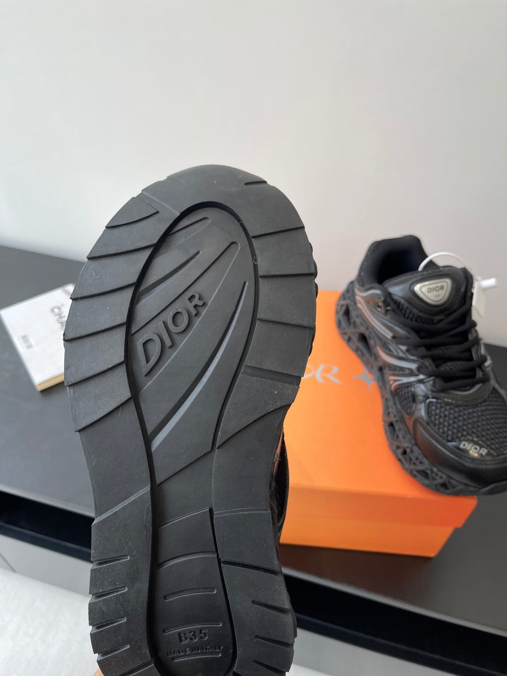 Dior ladies sneaker outsole, black tread with Dior logo