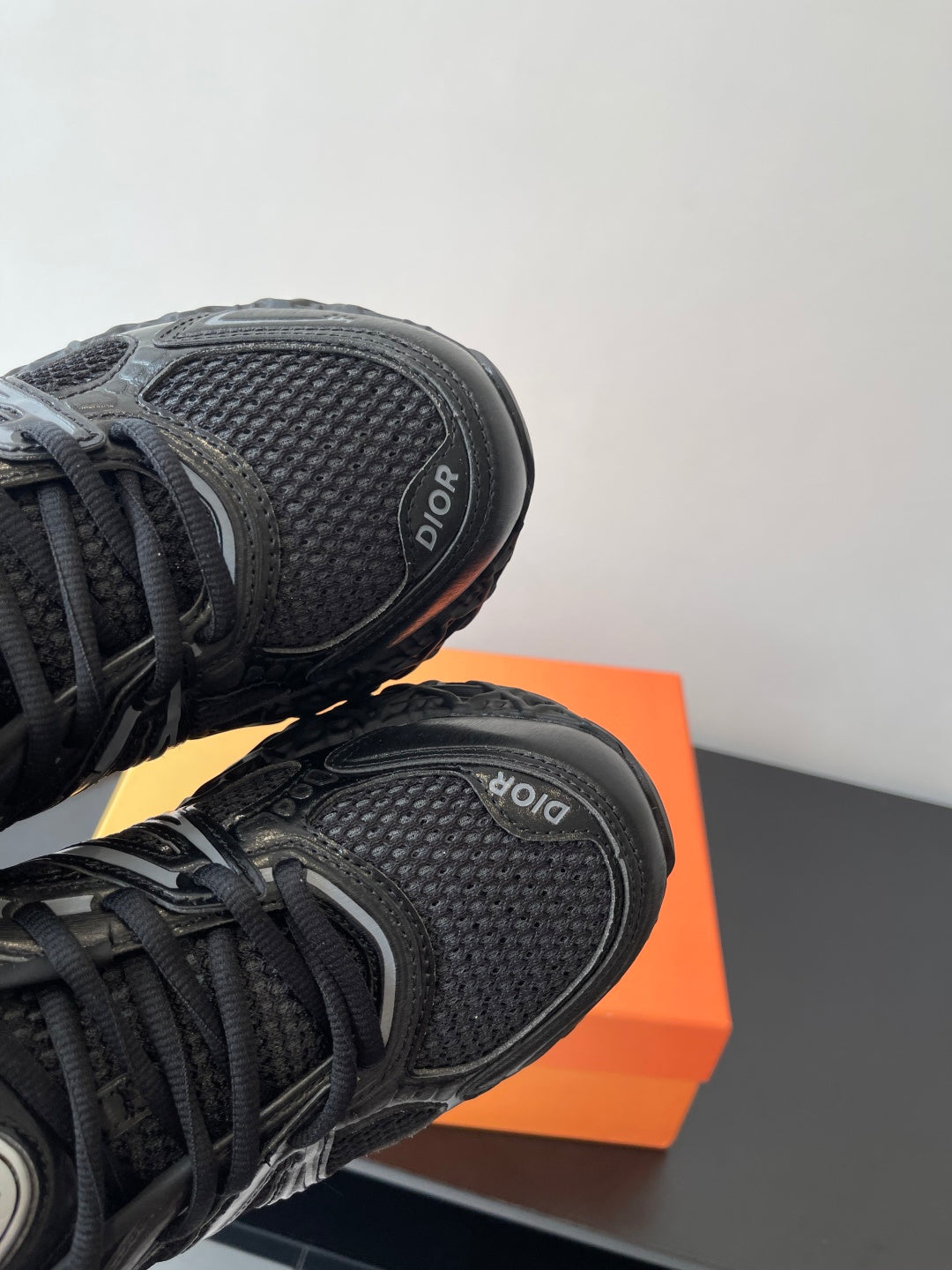 Dior ladies sneakers heel, black textured upper with Dior emblem