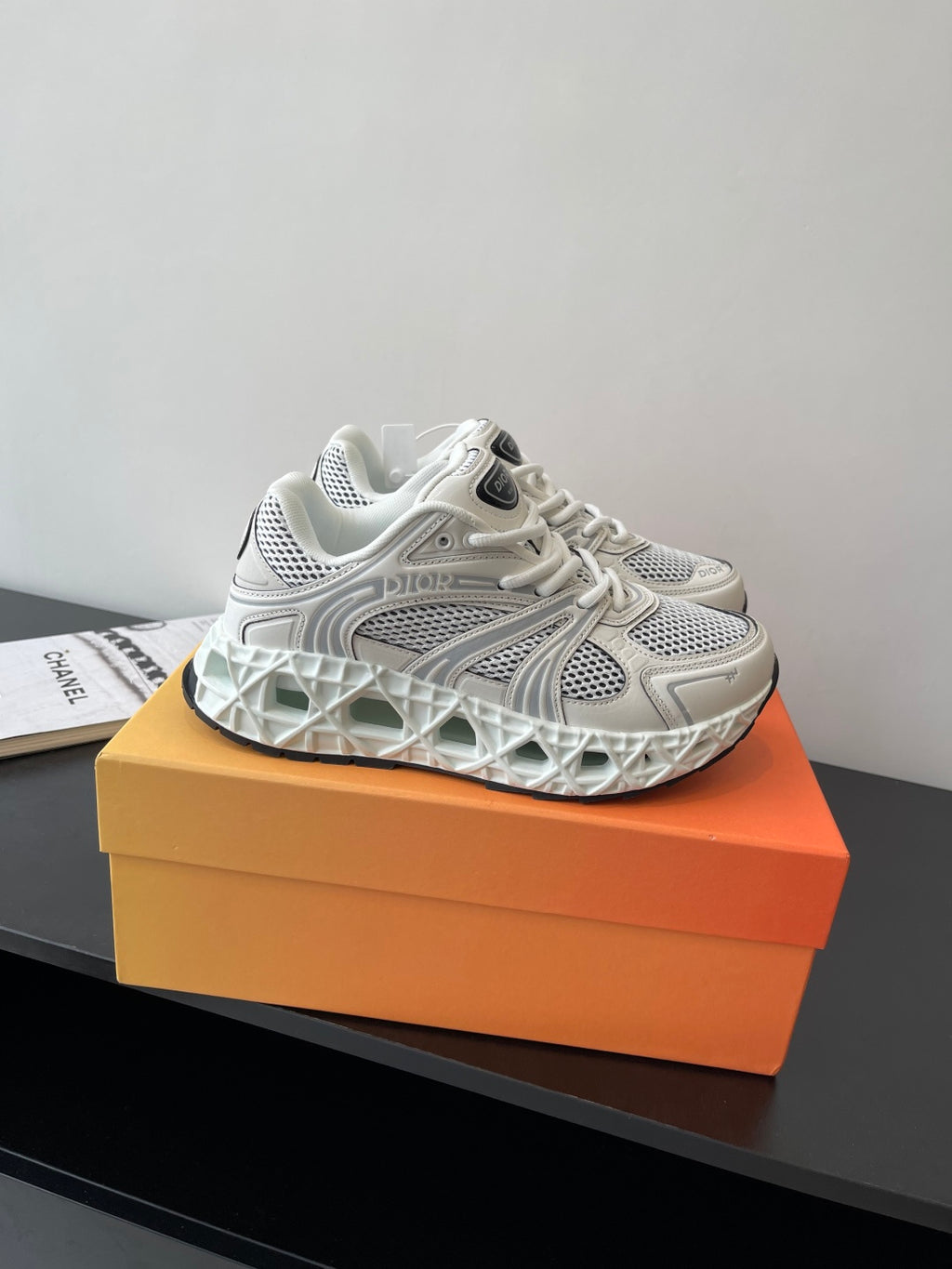 White lace-up sneaker side view with breathable mesh upper and sculpted sole
