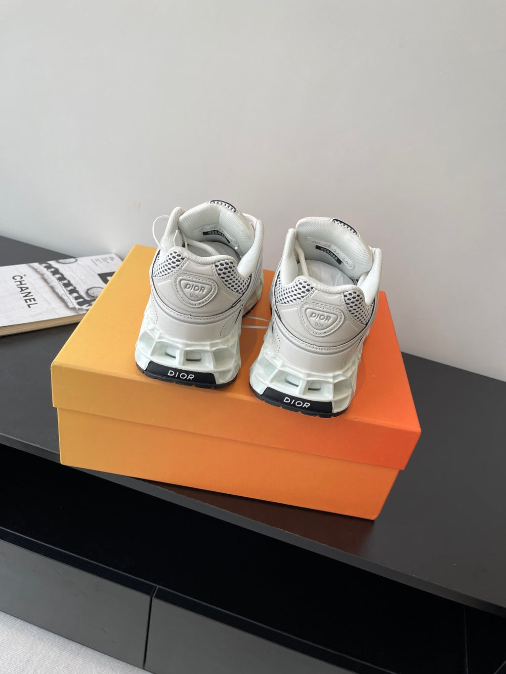 White back view lace-up sneakers with Dior logo on heel and padded collar