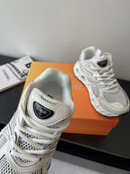 White lace-up sneaker close-up of Dior logo tongue and mesh upper