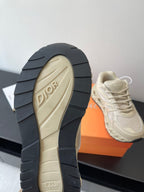 Cream sneaker outsole with DIOR logo on beige tread and stacked rubber segments