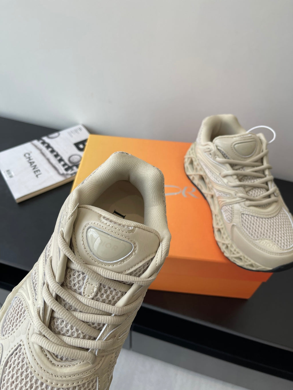 Cream lace-up sneaker view from inside heel and padded collar, women's Dior style