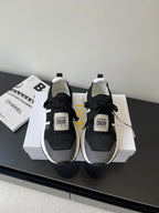 Dior women's black knit sneakers with white sole, lace-up and logo tongue patch