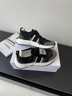 Dior women's black knit sneakers with white sole, lace-up and side strap accents